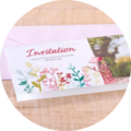 Beautiful invitation card with floral patterns and a gradient.
