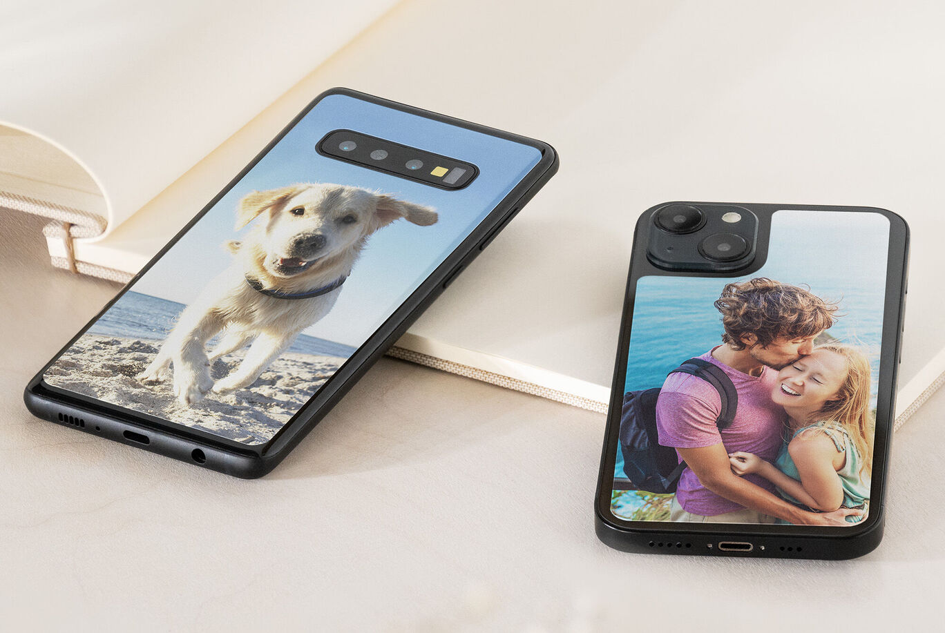 Two personalized smartphone cases featuring a dog and a romantic couple.