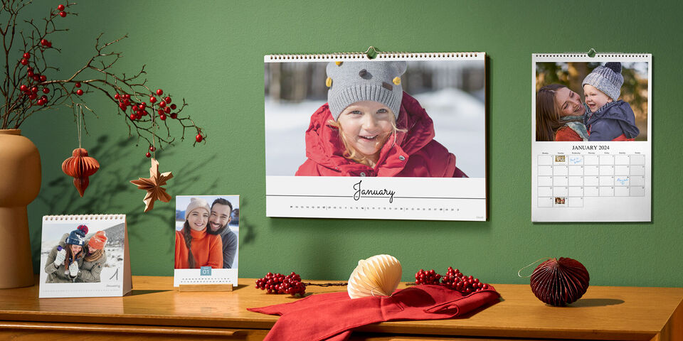 Selection of small to large photo calendars hanging on the wall