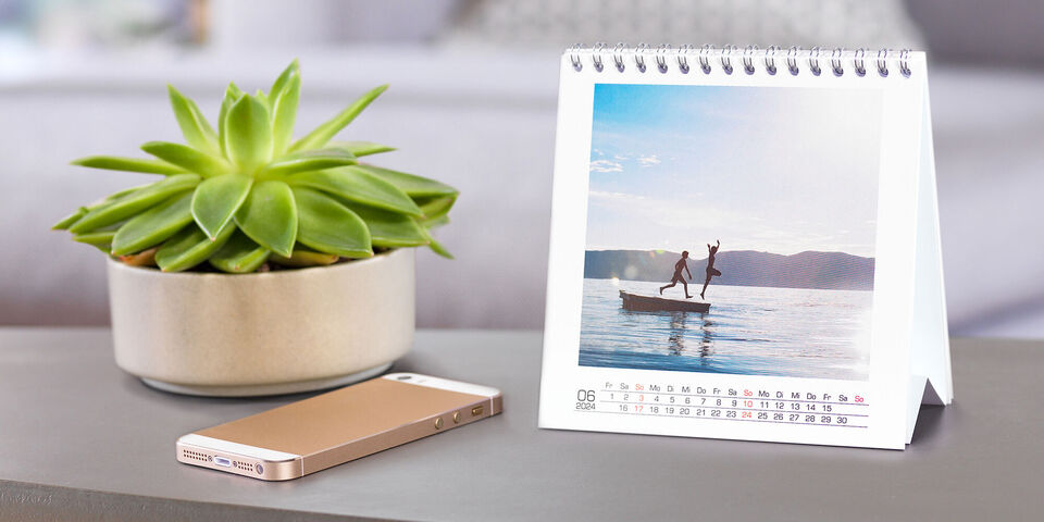 Personalised square desk calendar with images of kids jumping off pantoon